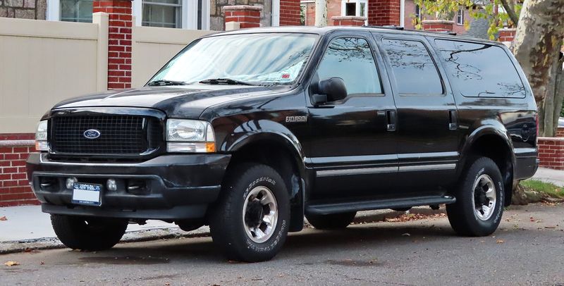 Black 2004 Ford Excursion SUV, front three-quarter view